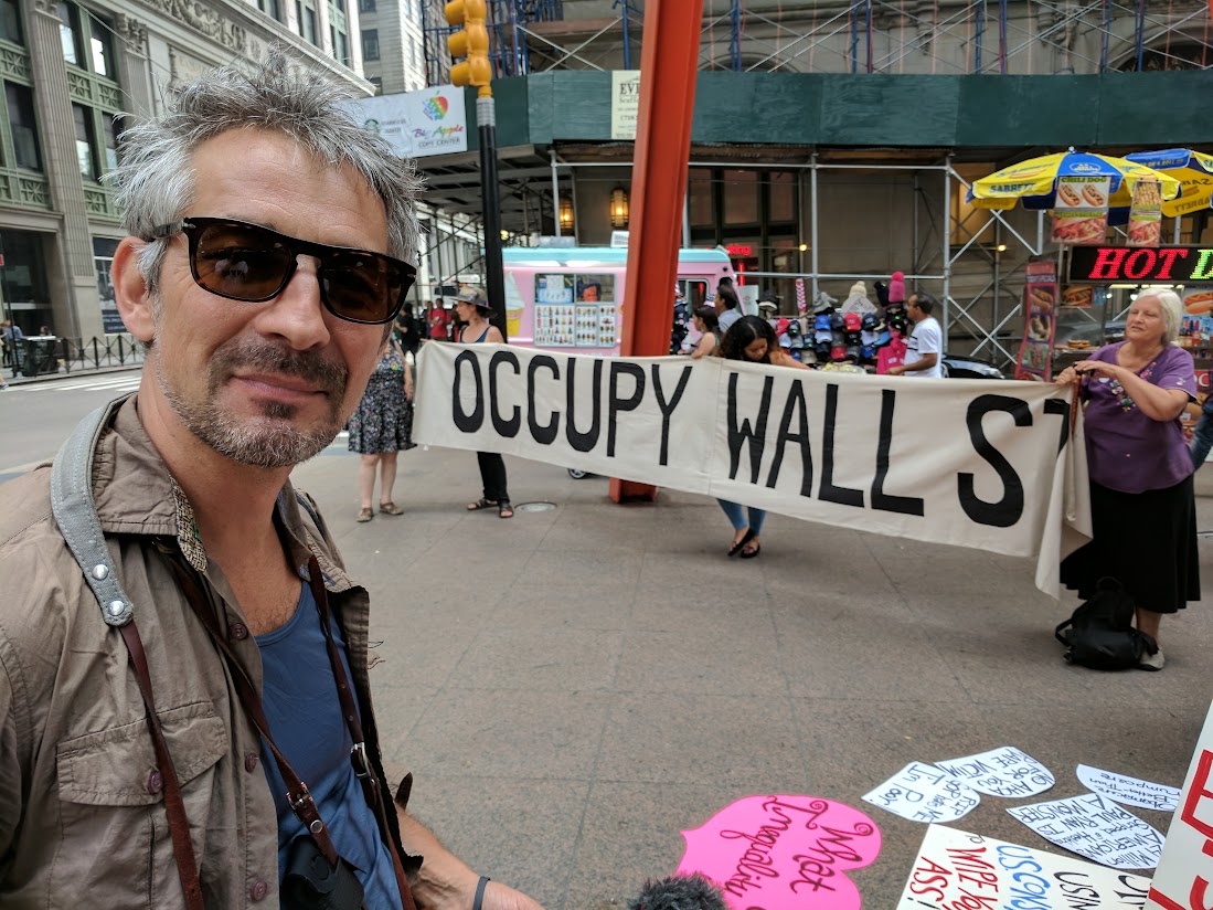 Patrick in front of OWS sign